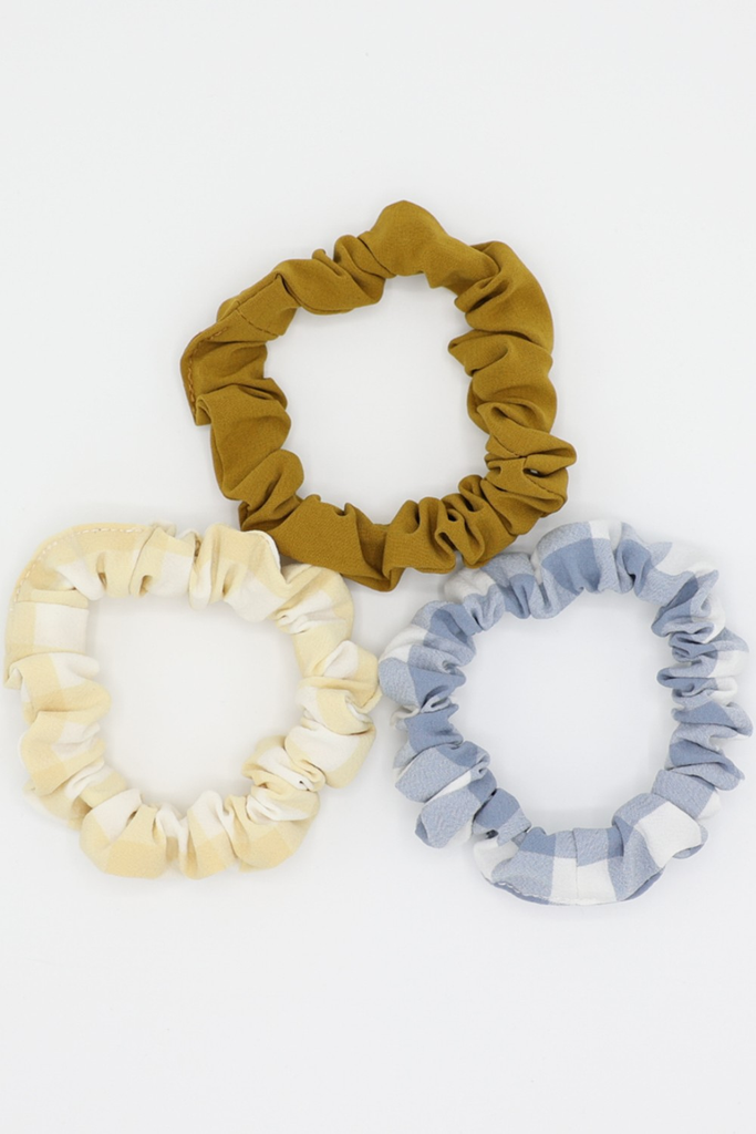 Pack of hair scrunchies in plaids and bronze