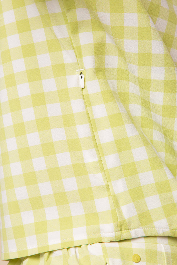 detail of the button up crop in lime plaid