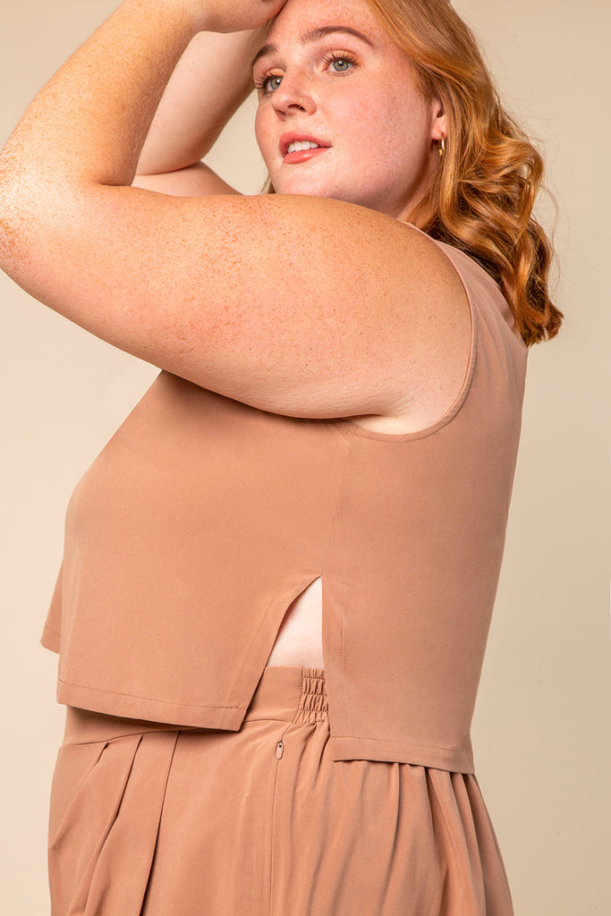 side view of the plus size travel tank in rose water